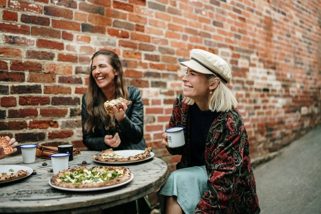 Friends eating their Pizza